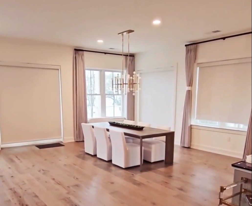 banded shades rolling up using motorization